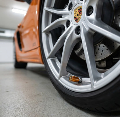 4 stk. Porsche Logo Ventilhætter i Orange Aluminium