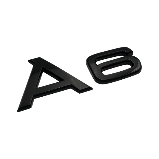 Svart Audi A6-emblem 