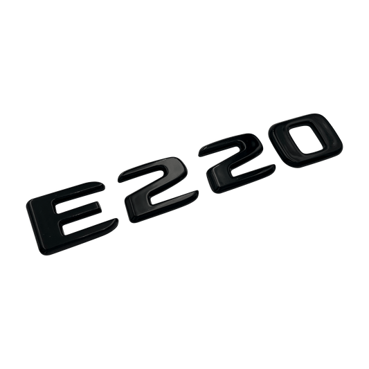 Svart Mercedes E220-emblem 